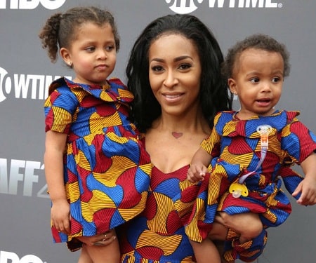 A picture of Amina Buddafly with her daughters.